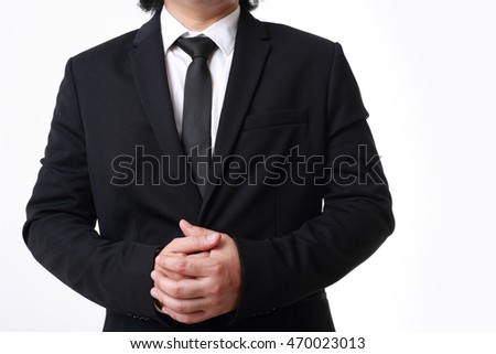 The Asian businessman standing on the white background.