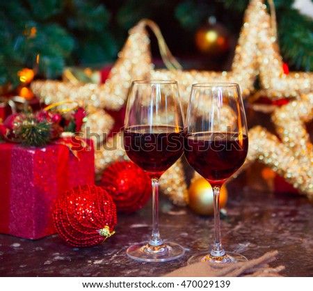 Two glasses of red wine on a Christmas tree background, Xmas Tree Decorated