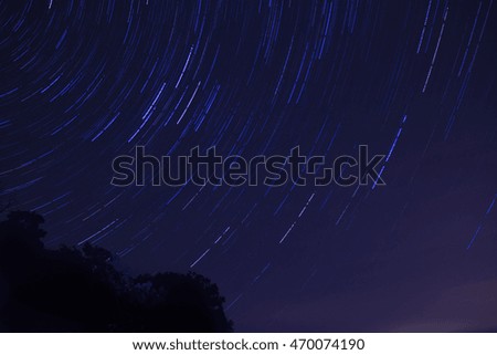 Blurred star trails in a night sky