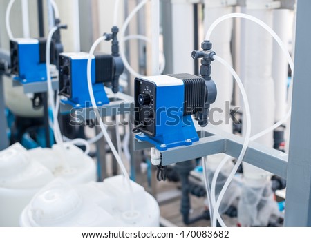 Chemical pump  used in waste water treatment,water filtration plants.the feed pump chemical into  the pipe water.  blur background selective focus. Royalty-Free Stock Photo #470083682