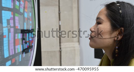 Asian lady looking at map