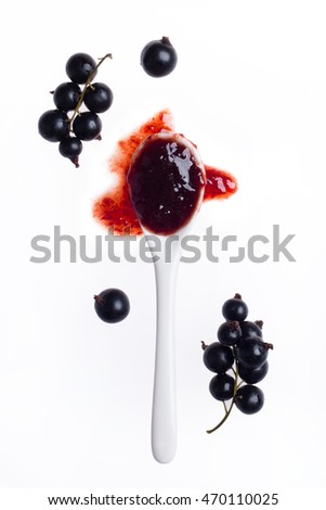 Spoon of jam with berries. Fragrant currant. View from the top Royalty-Free Stock Photo #470110025