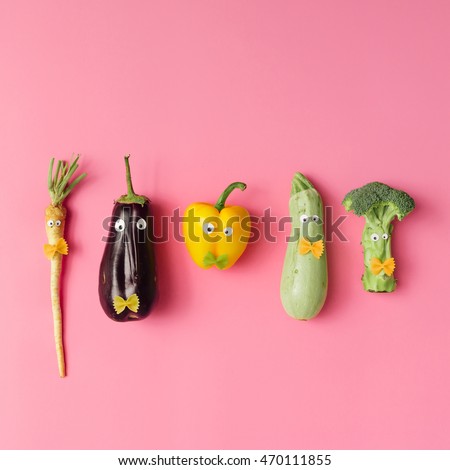 Various vegetable characters on pink background. Minimal concept.
