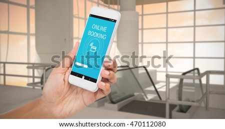 Cropped image of businesswoman holding smart phone against airport terminal