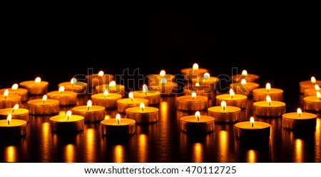 Many burning candles with shallow depth of field - peace concept