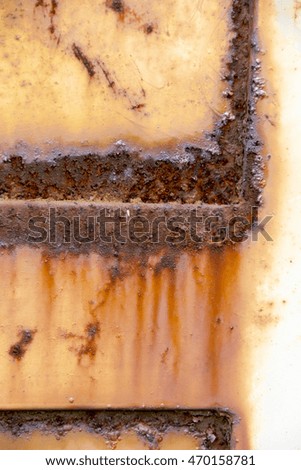Corroded white metal background. Rusted white painted metal wall. Rusty metal background with streaks of rust. Rust stains. The metal surface rusted spots. Rusty corrosion.
