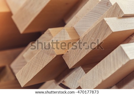 Wood timber construction material for background and texture. close up. Stack of wooden bars. small depth of field Royalty-Free Stock Photo #470177873