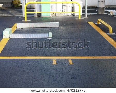 Parking lot equipped with wheel stoppers

