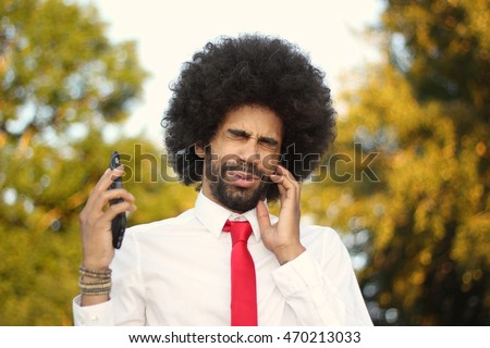 Beautiful business man with an afro outside