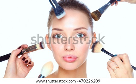 Closeup portrait picture of beautiful woman with brushes