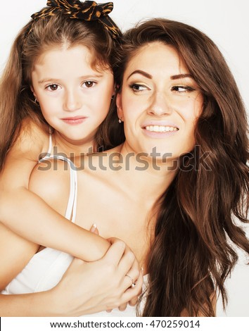 bright picture of hugging mother and daughter happy together, smiling stylish family.