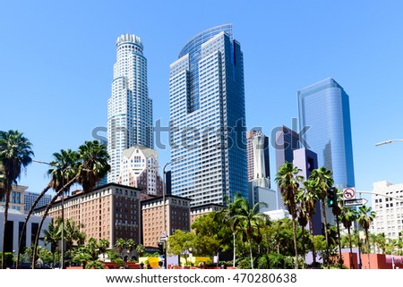 Downtown Los Angeles skyline over blue sky background