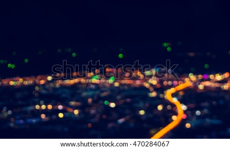 vintage tone blur image of Abstract city bokeh light for background usage  .