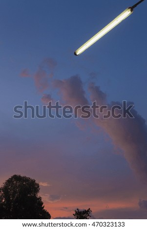 white fluffy clouds in the blue sky twilight.lamp
