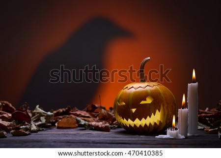 Pumpkin for Halloween, lamp pumpkin, crow silhouette, antique wood, celebrating halloween, smiley on a pumpkin, paraffin candles, bright background, angry face, burning candles, autumn dry leaves