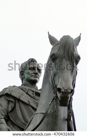 Memorial of King John at the Theaterplatz in Dresden, Germany - Closeup of the heads of rider and horse with light grey sky in the background
