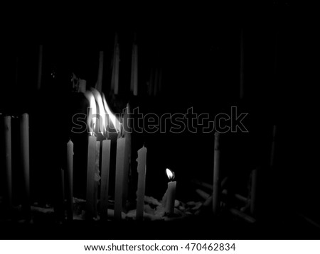 The monochrome of candles and flame