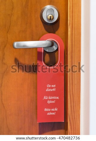 Do not disturb sign hanging on door knob.