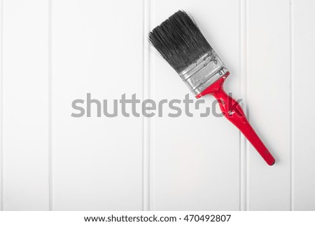 Old paint brush on white background