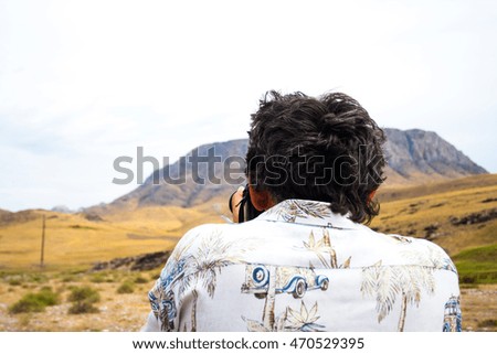 Man photographing mountains
