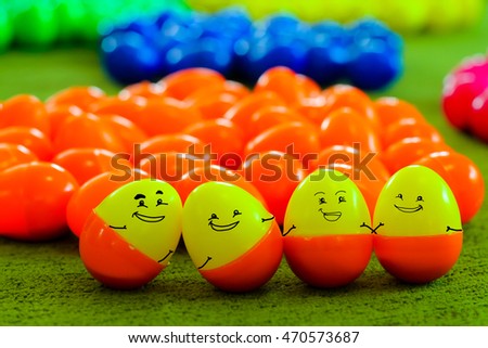 family concept : funny face on plastic eggs