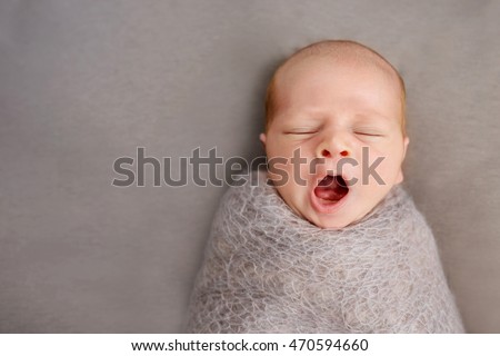 newborn baby yawns,Two week old 
 Royalty-Free Stock Photo #470594660