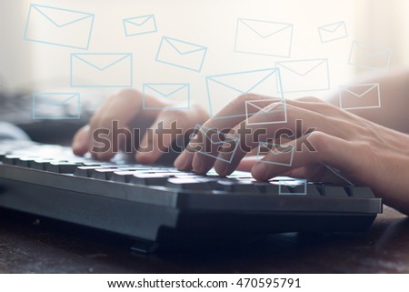 hand typing on keyboard to send electronic mail message