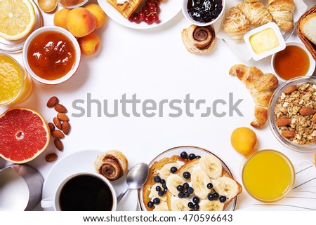breakfast with toasts, fruits, jam, coffee and buns. top view. place for text Royalty-Free Stock Photo #470596643