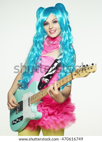The girl in anime-style guitar playing. Colorful background.