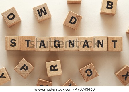 text of STAGNANT on cubes