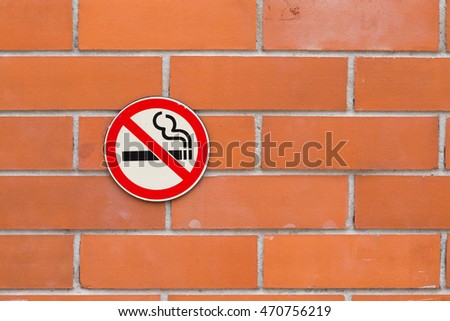 No smoking sign on red brick background