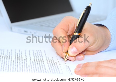 Businessman is signing a contract