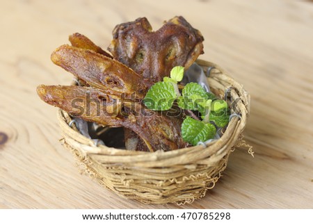 fried platypus on the basket.( fried duck mouth)