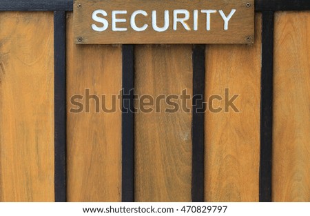 Wooden sign have a letters of security for design background.
