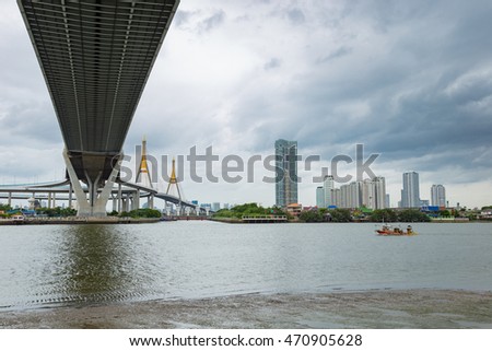 Highway bridge across Chaopraya river in Bangkok Thailand. Thai word in the photo is name of this bridge"Bhumiphol"