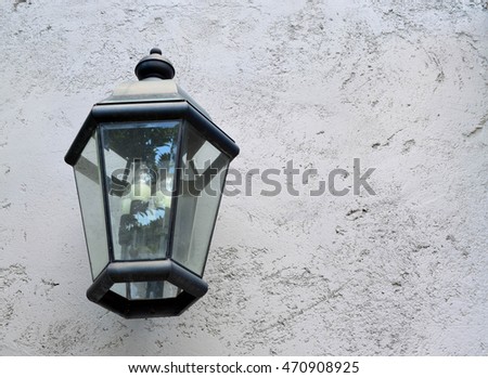 Classic hanging lamp on gray cement wall