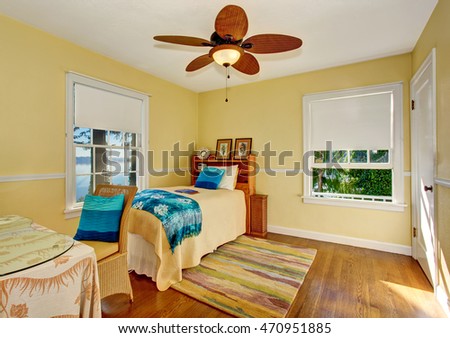 Craftsman bedroom interior with hardwood floor and rug. Northwest, USA