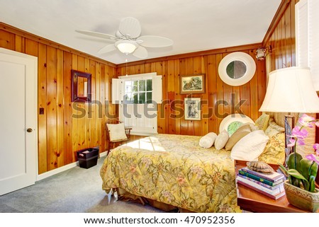 Craftsman bedroom interior with wooden pannel walls. Northwest, USA