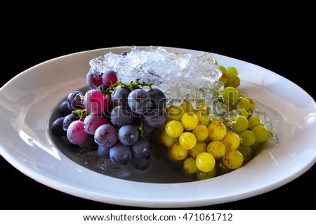 a dish of grape with ice