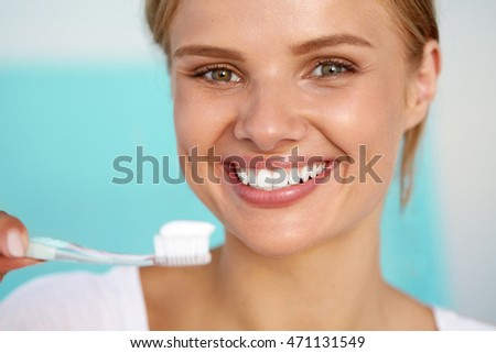 Brushing Teeth. Closeup Beautiful Happy Smiling Woman With Perfect Smile, Healthy White Teeth, Fresh Face Holding Toothbrush With Toothpaste. Oral Hygiene, Dental Health Concept. High Resolution Image