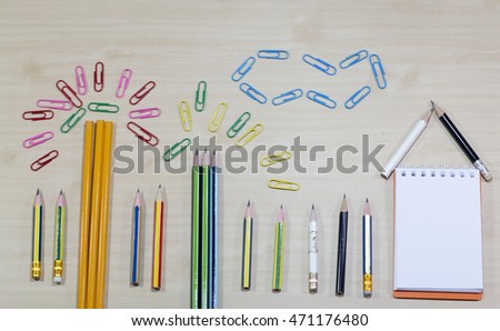 group of pencil,note  on wooden desk