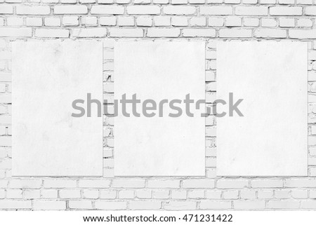 White frames on brick wall