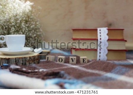 Love reading. Love books.Books and coffee. White cup. Love word. Love letters. Shabby love. Rustic love. Love wooden letters. Love and flowers.Gipsophila and books. 