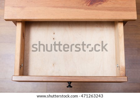 top view of empty open drawer of nightstand Royalty-Free Stock Photo #471263243