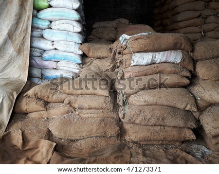 Jute Bag and PP bag with Raw Material Royalty-Free Stock Photo #471273371
