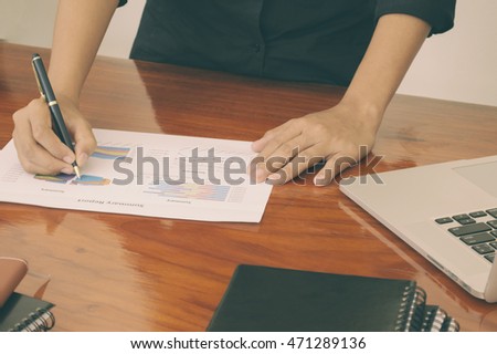 Woman and getleman hands working with laptop,phone,notepad in business office.