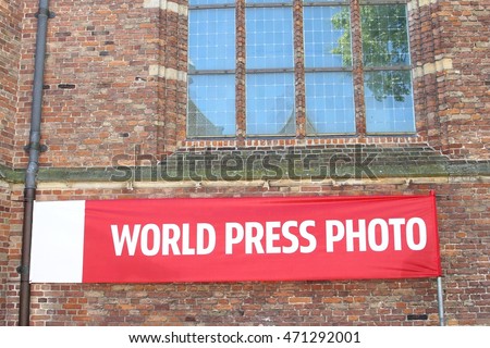 Banner sign of yearly World Press Photo event in Amsterdam, Netherlands. This international exhibition can be watched in many cities of the world.