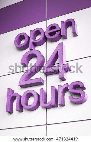 Generic purple 3D 'Open 24 Hours' wall sign.