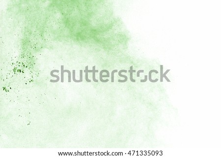 Abstract green powder splatted on white background