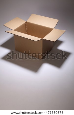 open cardboard box on the gray background